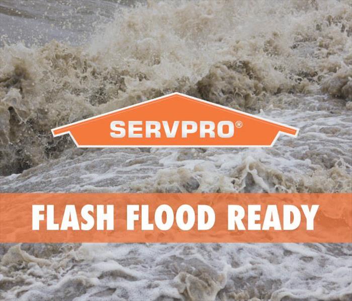rushing flood waters covered with SERVPRO logo